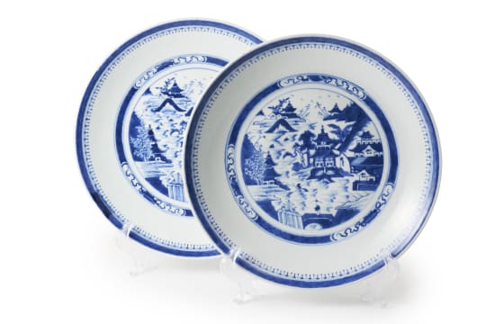 A pair of Chinese blue and white porcelain plates painted with a mountain landscape scene, 19th century