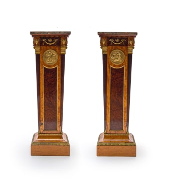 A pair of Empire style mahogany, birds-eye-maple and satinwood-veneered gilt-brass mounted pedestals, late 19th/early 20th century