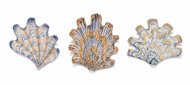 Lucie de Moyencourt; Three glazed ceramic shells with navy and beige motifs