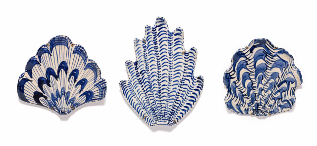 Lucie de Moyencourt; Three glazed ceramic shells with blue and white motifs