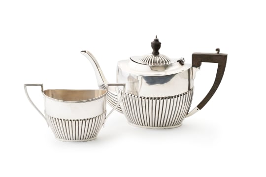 An assembled Edward VII silver teapot and silver-plated sugar basin, William Devenport, Birmingham, 1905