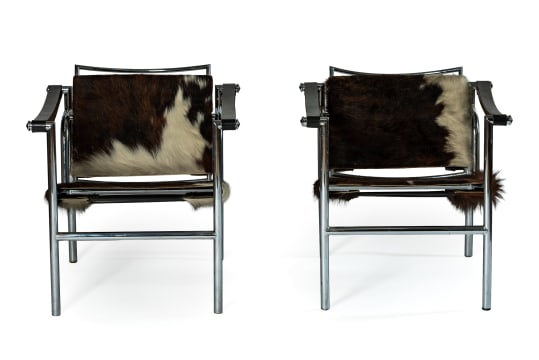 Le Corbusier, Pierre Jeanneret & Charlotte Perriand; Pair of 'LC1' cowhide, leather and chrome armchairs after a 1928 design by Le Corbusier, Pierre Jeannert and Charlotte Periand, Italy