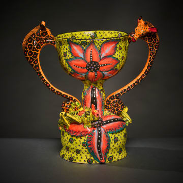 Stemmed giraffe and cricket bowl with handles