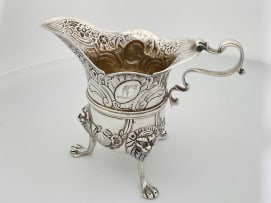 An Irish silver cream jug, apparently unmarked, Dublin, date letter worn, possibly 1760