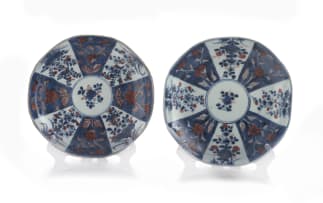 A pair of Chinese blue and white 'clobbered' dishes, Qing Dynasty, Qianlong period, 1736-1795 and later