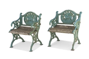 A pair of Victorian style 'Fern & Dog' wrought-iron armchairs