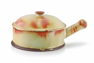 A Linn Ware cream-and-russet-glazed casserole dish and cover