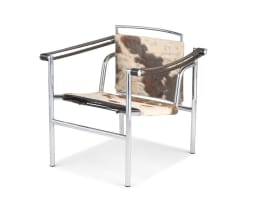 An LC1 cowhide and chrome armchair designed in 1928 by Le Corbusier, Pierre Jeanneret and Charlotte Periand, 1980s