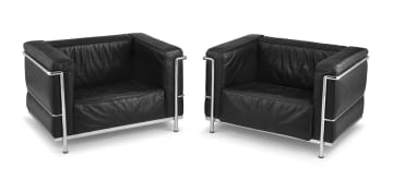 A pair of LC3 black leather armchairs designed by Le Corbusier, Pierre Jeanneret and Charlotte Perriand, later edition