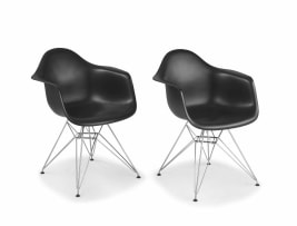 A pair of DAR plastic and chrome armchairs designed in the 1950s by Charles and Ray Eames for VITRA, 2005