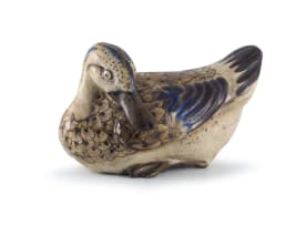 A porcelain blue, brown and cream-glazed duck, late 19th/early 20th century