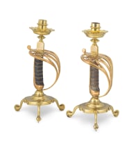 A fine pair of English copper and brass sword hilt candlesticks, late 19th century