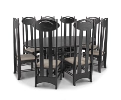 A set of eight black stained chairs and dining table designed by Charles Rennie Mackintosh, later edition