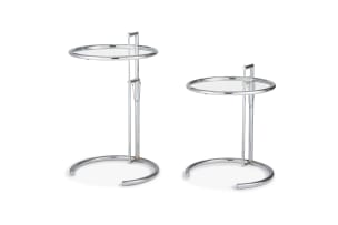 A pair of E1027 glass and chrome tables designed by Eileen Gray