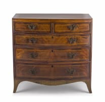 A George III style mahogany and inlaid bowfronted chest of drawers, 19th century