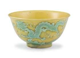 A Chinese yellow-and-green-glazed dragon bowl, Qing Dynasty, 19th century