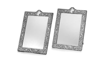An impressive pair of late Victorian silver-mounted table mirrors, William Comyns & Sons Ltd, London, 1894 and 1895