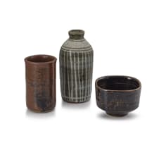Brown stone cylinder vase, brown bowl and a bottle vase