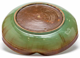 A Linn Ware leaf-green and russet-glazed petal-shaped dish