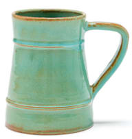 A Linn Ware pale green and russet-glazed tankard