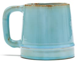 A Linn Ware pale blue-glazed tankard