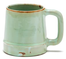 A Linn Ware celadon and rust-glazed tankard