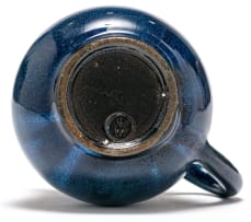 A Linn Ware dark blue-glazed jug