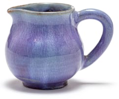 A Linn Ware lavender-glazed cream jug