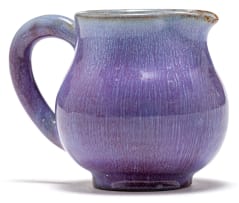A Linn Ware lavender-glazed cream jug