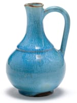 A Linn Ware stippled blue-glazed condiment pourer