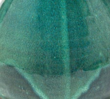 A Globe green-glazed ewer