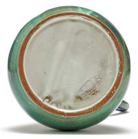 A Globe green-glazed ewer