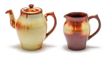 A Linn Ware cream and russet-glazed tea pot