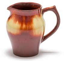 A Linn Ware cream and russet-glazed tea pot