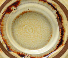 A Linn Ware cream and russet-glazed ashtray