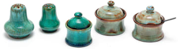 Three Linn Ware condiment jars and covers