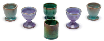 Four Linn Ware green-glazed egg cups