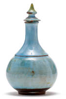 A Linn Ware blue-glazed condiment pourer and cover