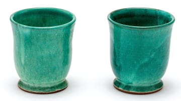 Two South African ceramic green-glazed beakers