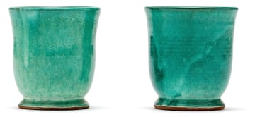 Two South African ceramic green-glazed beakers