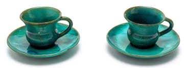 Two Linn Ware green-glazed coffee cups and saucers
