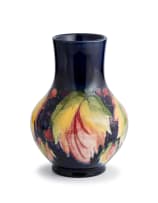A William Moorcroft 'leaf-and-berry' pattern vase, 1928-1949
