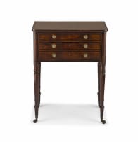 A George IV mahogany and rosewood writing table