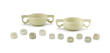 Two Chinese celadon jade two-handled libation cups, Qing Dynasty, 19th century