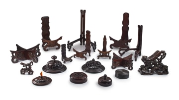 A collection of seventeen Chinese hardwood stands and covers, Qing Dynasty, 18th/19th century