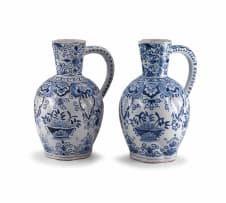 A near pair of Delft blue and white faience ewers, 19th century