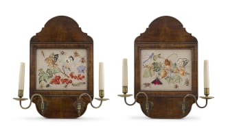 A pair of George II style walnut and embroidered sconces