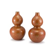 A pair of Chinese burnt-orange-glazed and gilt double-gourd vases