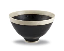 A mirror black and cream-glazed bowl, Lucie Rie (1902-1995), 1950s