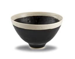 A mirror black and cream-glazed bowl, Lucie Rie (1902-1995), 1950s